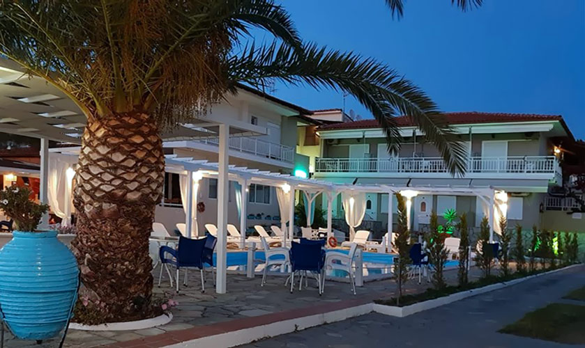Pool & Poolside view at night of Sunset Hotel in Paradissos Beach Neos Marmaras Sithonia